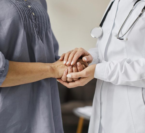 covid-recovery-center-female-doctor-holding-older-patient-s-hands