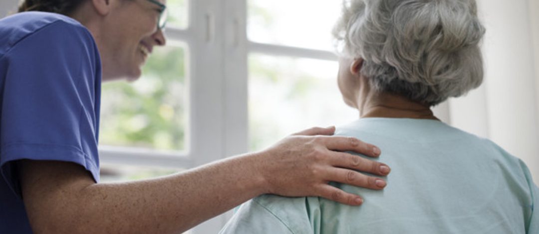 Nurse taking care of an old woman